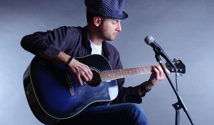 playing guitar and singing